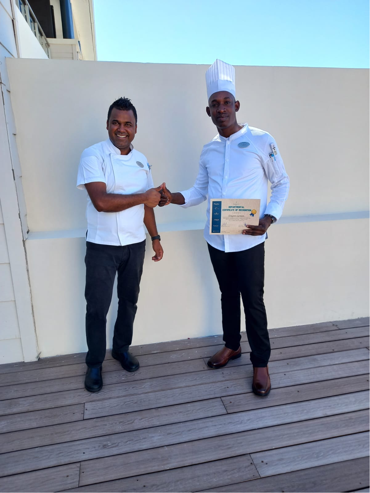 Paradise Taste Buds chef receiving a Departmental Certificate of Recognition for culinary excellence.