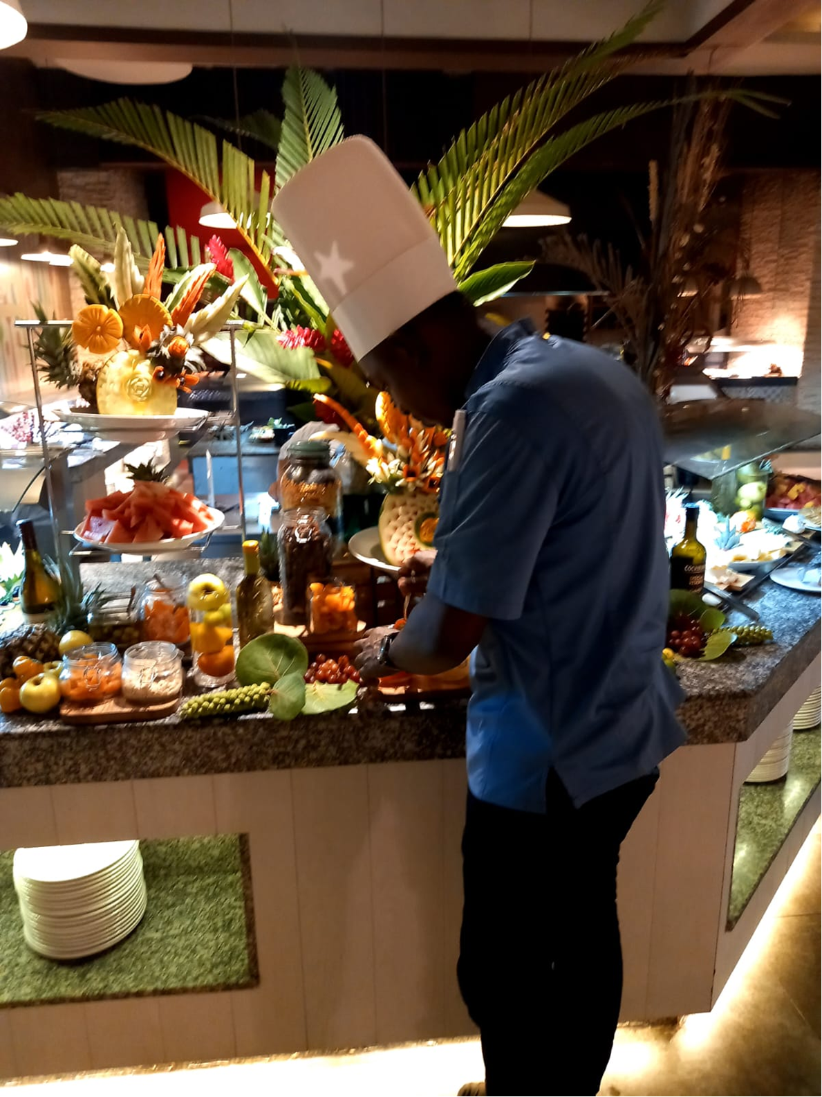 Chef Dejon preparing buffet garnishes.
